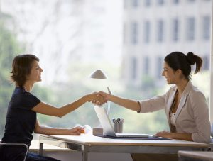 Businesswomen shaking hands